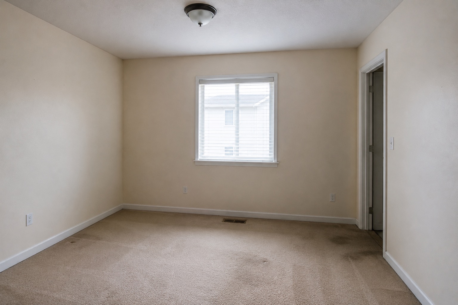 Before view of an empty Edmonton room before custom closet built-ins